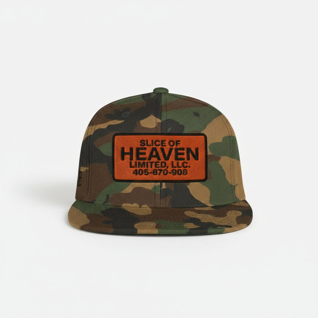 Camouflage cap with 'Slice of Heaven Limited, LLC' patch held by a person