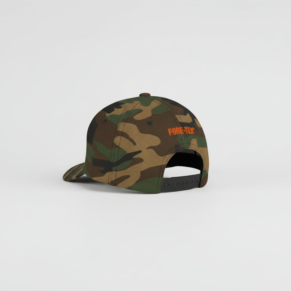 Camouflage cap with 'FORE-TEX' logo worn by a person on a white background